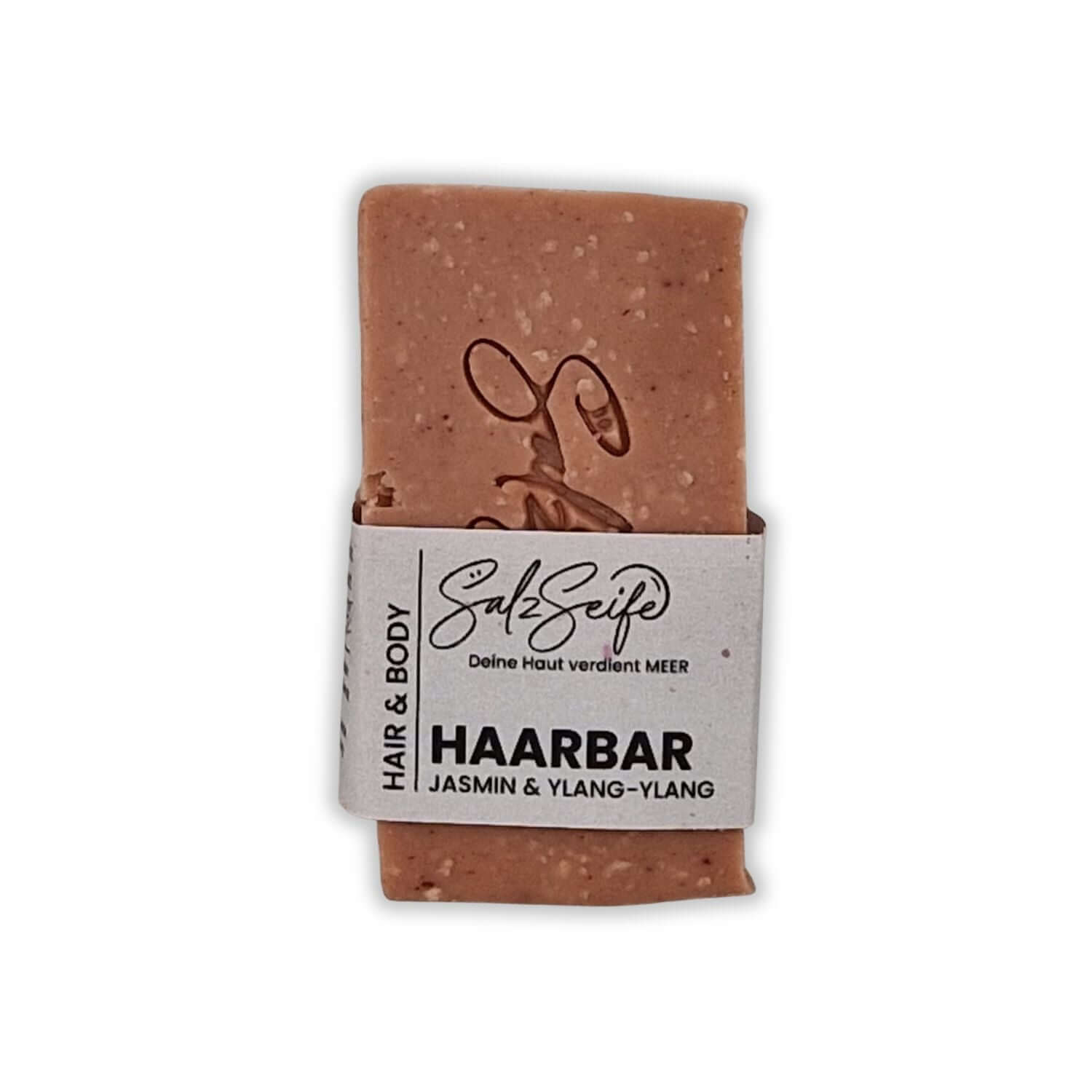 HaarBar Haarseife als roséfarbenes Seifenstück auf hellem Hintergrund